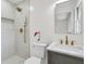 Updated bathroom featuring walk-in shower with designer fixtures and vanity with a marble countertop at 5172 Sterrett St, North Charleston, SC 29405