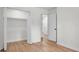Bright bedroom with hardwood floors, white trim, and closet for ample storage at 5172 Sterrett St, North Charleston, SC 29405