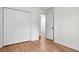 Light and airy bedroom with hardwood floors, white trim, and spacious closet at 5172 Sterrett St, North Charleston, SC 29405