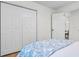 Bedroom featuring hardwood floors, closet, and open doorway to the other parts of the home at 5172 Sterrett St, North Charleston, SC 29405