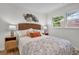 Serene bedroom featuring a wicker headboard, two side tables, and a cozy leaf-patterned comforter at 5172 Sterrett St, North Charleston, SC 29405