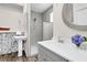 Bathroom with standalone shower, white pedestal sink, and decorative mirror at 5233 Maybank Hwy, Wadmalaw Island, SC 29487