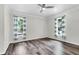 Bright bedroom with wood floors and large windows at 5233 Maybank Hwy, Wadmalaw Island, SC 29487