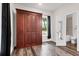 Bedroom with Murphy bed and view to bathroom with standalone shower at 5233 Maybank Hwy, Wadmalaw Island, SC 29487