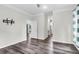 Bright bedroom showcasing hardwood floors and a wall-mounted TV bracket at 5233 Maybank Hwy, Wadmalaw Island, SC 29487