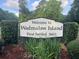 Welcome to Wadmalaw Island sign surrounded by green foliage and trees at 5233 Maybank Hwy, Wadmalaw Island, SC 29487