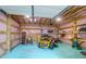 Inside the garage is the lawn equipment, tools, and a workbench at 5233 Maybank Hwy, Wadmalaw Island, SC 29487