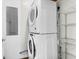 Laundry area featuring stacked washer and dryer appliances for efficient space use at 5233 Maybank Hwy, Wadmalaw Island, SC 29487