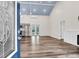 Open-concept living space with vaulted ceilings, modern flooring, and stainless steel appliances at 5233 Maybank Hwy, Wadmalaw Island, SC 29487