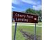 A street sign for Cherry Point Landing on a sunny day at 5233 Maybank Hwy, Wadmalaw Island, SC 29487