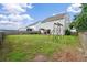 Large backyard with play set and covered patio, offering ample space for outdoor activities at 535 Crossland Dr, Moncks Corner, SC 29461
