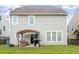Exterior of home featuring backyard with pergola-covered patio and well-maintained lawn at 535 Crossland Dr, Moncks Corner, SC 29461