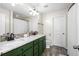 Bathroom features double sinks with granite counters, modern fixtures, and stylish green cabinets at 535 Crossland Dr, Moncks Corner, SC 29461