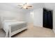 Inviting bedroom with sloped ceiling, featuring neutral walls, ceiling fan, plush carpet, and bright natural light at 535 Crossland Dr, Moncks Corner, SC 29461