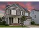 Beautiful two-story home with gray siding, well-maintained lawn, and welcoming front porch at 535 Crossland Dr, Moncks Corner, SC 29461