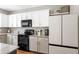 A view of the kitchen including stainless steel appliances, modern cabinets, and granite countertops at 535 Crossland Dr, Moncks Corner, SC 29461