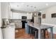 Modern kitchen boasts granite countertops, an island with seating, and stainless steel appliances at 535 Crossland Dr, Moncks Corner, SC 29461