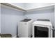 Functional laundry area equipped with modern washer and dryer units, and painted with light blue walls at 535 Crossland Dr, Moncks Corner, SC 29461
