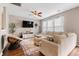 Comfortable living room featuring a plush sectional sofa, large television, and a ceiling fan at 535 Crossland Dr, Moncks Corner, SC 29461