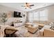 Cozy living room featuring a sectional sofa, modern television, and a stylish accent chair at 535 Crossland Dr, Moncks Corner, SC 29461