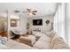 Comfortable living room with a plush sectional sofa, television, ceiling fan, and neutral color scheme at 535 Crossland Dr, Moncks Corner, SC 29461
