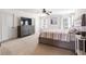 Main bedroom with a large bed, carpet, and ample natural light at 535 Crossland Dr, Moncks Corner, SC 29461