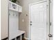 Mudroom with a built in bench, hooks for coats, and storage cubbies at 535 Crossland Dr, Moncks Corner, SC 29461