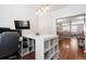 Bright and functional office space featuring a built-in desk, hardwood floors, and modern lighting at 535 Crossland Dr, Moncks Corner, SC 29461