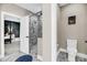 Bathroom with modern shower, toilet, and open door view into the main bedroom at 5725 Caviar Ct, Johns Island, SC 29455