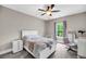 A bedroom with a ceiling fan, desk, and a cozy hammock chair offers a comfortable living space at 5725 Caviar Ct, Johns Island, SC 29455