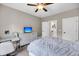 Bedroom with a white dresser, ceiling fan, and desk, and view into the upstairs hallway at 5725 Caviar Ct, Johns Island, SC 29455
