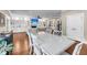 Modern dining room offering a clear view of the open living space with built-in shelves and fireplace at 5725 Caviar Ct, Johns Island, SC 29455