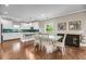 Open dining area with a white table and decorative chairs, blending seamlessly with the updated kitchen at 5725 Caviar Ct, Johns Island, SC 29455