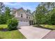 Charming home featuring a two-car garage, well-kept landscaping, and a welcoming entrance at 5725 Caviar Ct, Johns Island, SC 29455