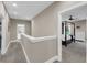 A carpeted hallway with views of a bedroom and a bathroom, offering easy access to amenities at 5725 Caviar Ct, Johns Island, SC 29455