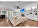 Spacious living room featuring hardwood floors, built-in shelving, and a cozy fireplace at 5725 Caviar Ct, Johns Island, SC 29455