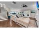 Open floor plan with living room showcasing hardwood floors, lots of sunlight, and kitchen access at 5725 Caviar Ct, Johns Island, SC 29455