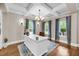Bright office featuring custom shelving, coffered ceilings, and hardwood flooring at 5725 Caviar Ct, Johns Island, SC 29455