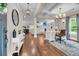 Open-concept home with dedicated office space featuring hardwood floors and stylish decor at 5725 Caviar Ct, Johns Island, SC 29455
