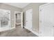 A well-lit room with doorways to a bathroom with a marble shower, and other rooms at 5725 Caviar Ct, Johns Island, SC 29455