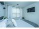 Bedroom with window, mounted TV, and minimalist decor providing a modern look at 618 Ravensridge Ln, Moncks Corner, SC 29461