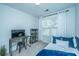 Functional bedroom with desk, TV, and cozy daybed offering a comfortable and efficient setup at 618 Ravensridge Ln, Moncks Corner, SC 29461