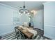 Comfortable dining area boasts modern lighting, a rustic table, and stylish accents for enjoyable meals at 618 Ravensridge Ln, Moncks Corner, SC 29461