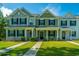 Inviting townhomes feature well-maintained lawns and colorful facades, enhancing the curb appeal at 618 Ravensridge Ln, Moncks Corner, SC 29461