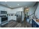 Well-lit kitchen featuring white cabinets, stainless steel appliances, and an inviting layout with modern finishes at 618 Ravensridge Ln, Moncks Corner, SC 29461
