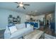 Open-concept living space with kitchen island, modern furnishings, and a bright, airy atmosphere perfect for entertaining at 618 Ravensridge Ln, Moncks Corner, SC 29461