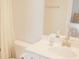 Bathroom featuring a modern sink with brushed gold hardware, and a large, well-lit mirror at 683 Yellow Leaf Ln, Summerville, SC 29486
