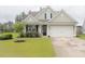Charming single-Gathering home with a manicured lawn and attached two-car garage at 683 Yellow Leaf Ln, Summerville, SC 29486