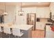 Bright kitchen features stainless steel appliances, white cabinets, and a large center island with seating at 683 Yellow Leaf Ln, Summerville, SC 29486