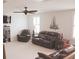 Comfortable living room featuring plush leather seating and a ceiling fan for added comfort at 683 Yellow Leaf Ln, Summerville, SC 29486